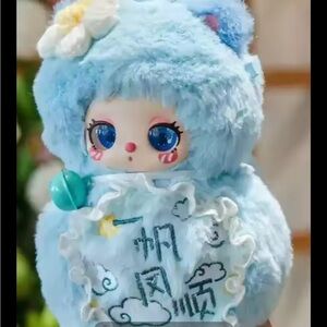 Charming Blue Plush Doll with Floral Accent